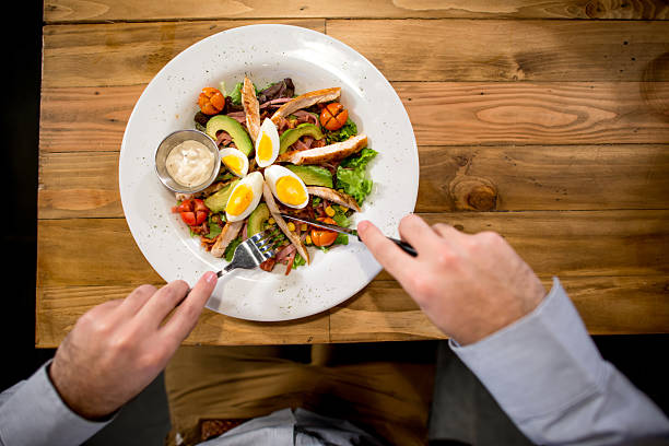istock Man eating a healthy salad 509872644
