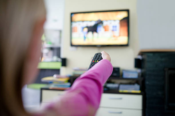 istock Girl watching TV 509872968