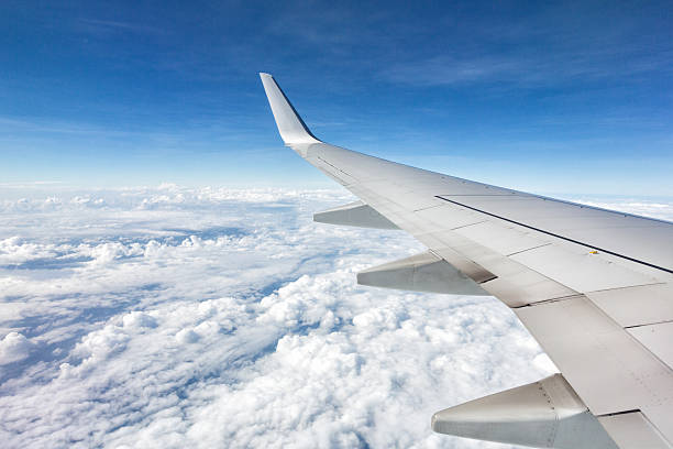 istock Airplane Flying above the Clouds 509890973