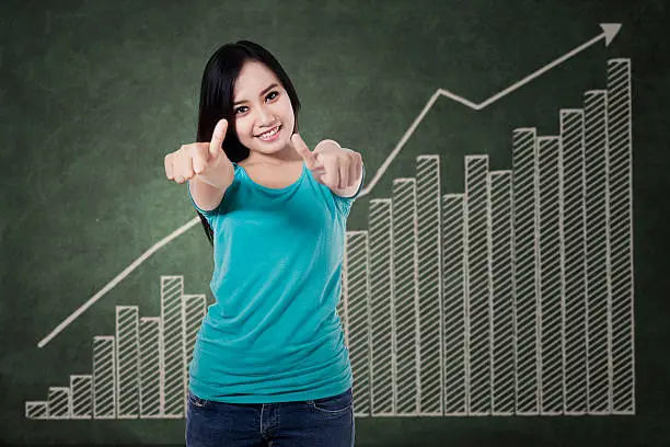 Photo of Smiling woman giving thumbs up