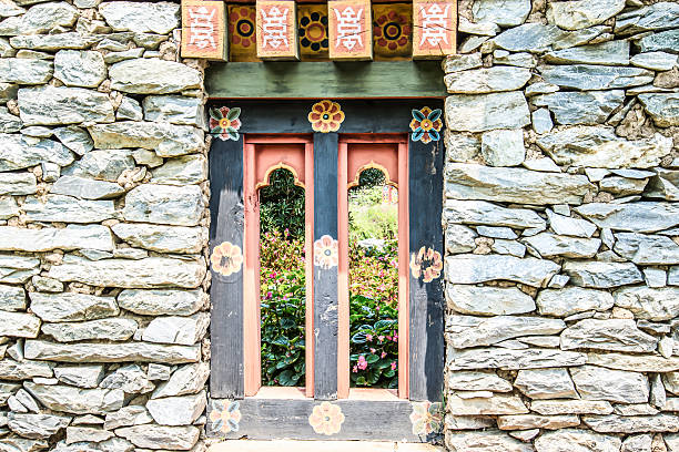 istock Wooded window and rock wall from bhutan 509895075