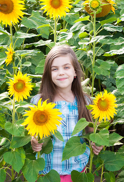 istock Beautiful child with sunflower 509896075