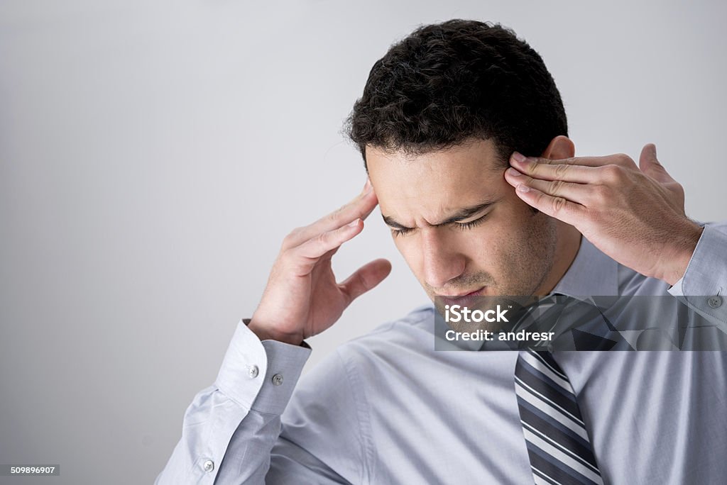 Business man with a headache Stressed business man with a headache Adult Stock Photo