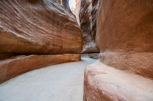 Detailed view of The Siq, the narrow canyon that serves as the entrance passage to the sacred city of Petra.