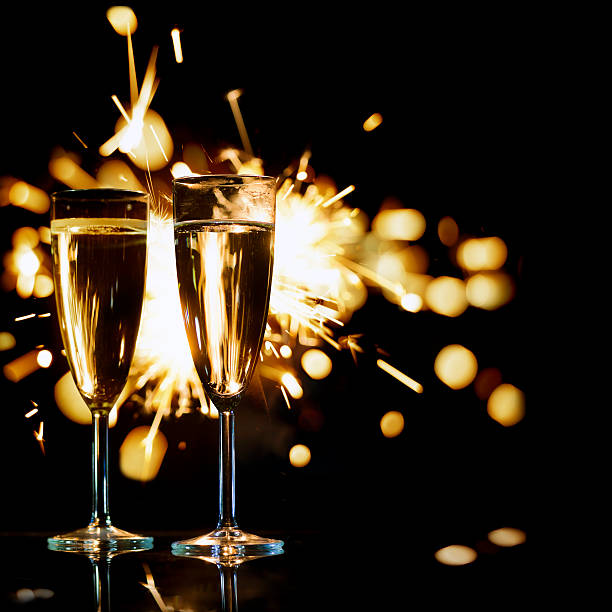 istock Champagne Glasses Infront Of Fireworks – New Year 2016 509897267