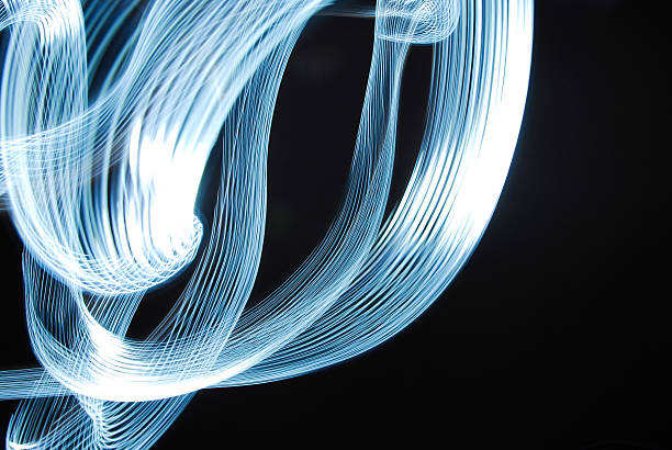 istock Light trails in darkroom. Long exposure photo 509897777