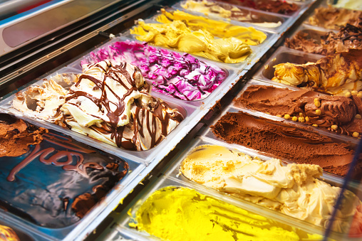 Many boxes of Italian ice cream gelato in a shop