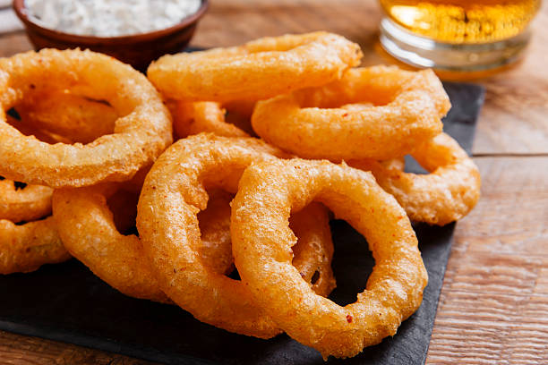 istock fried onion rings in batter with sauce 509911520