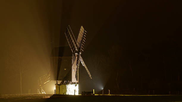 istock Post mill by nigt in rain with light streaks 509911652