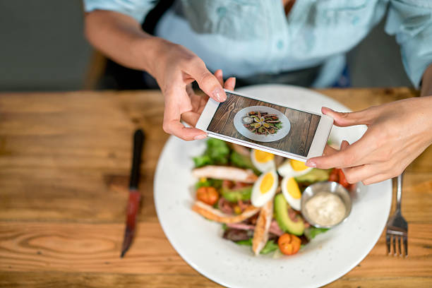 istock Woman using food app on her cell phone 509912664