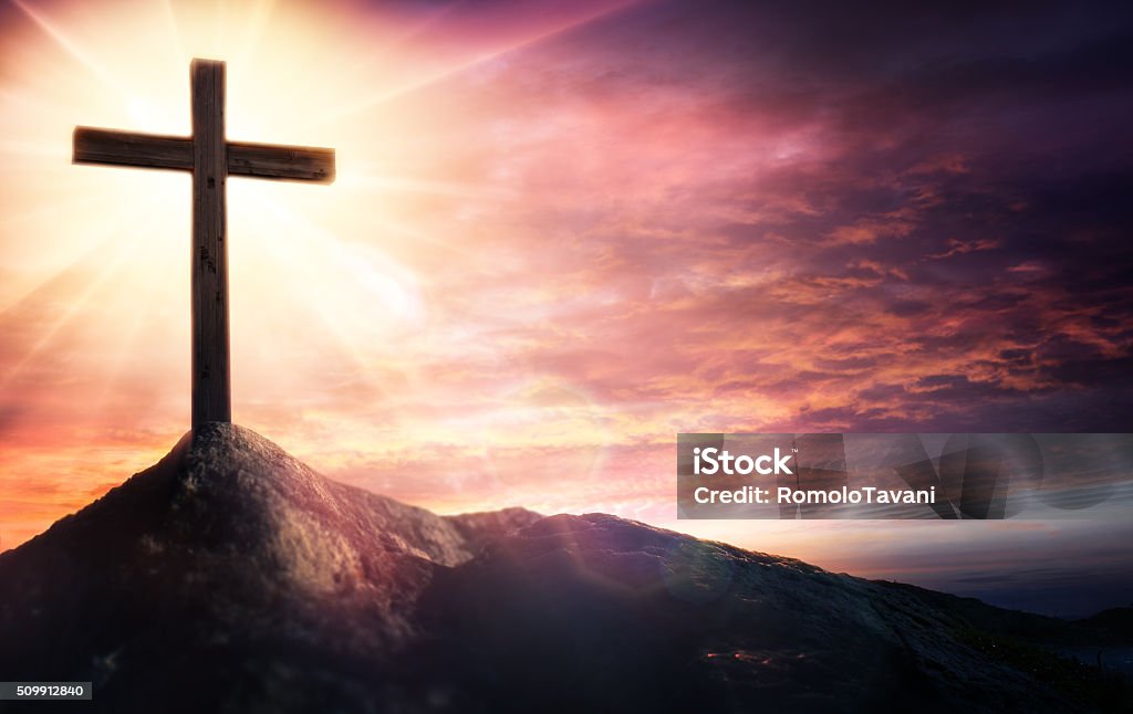 Mystery Of The Crucifix - Symbol Of Faith Cross At Sunset On Hill With Rays Religious Cross Stock Photo