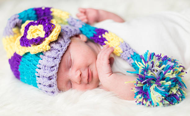 istock Baby with hat on fur 509915392