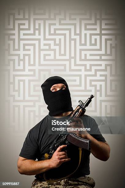 Man With Gun And Maze Stock Photo - Download Image Now - Adult, Adversity, Aggression