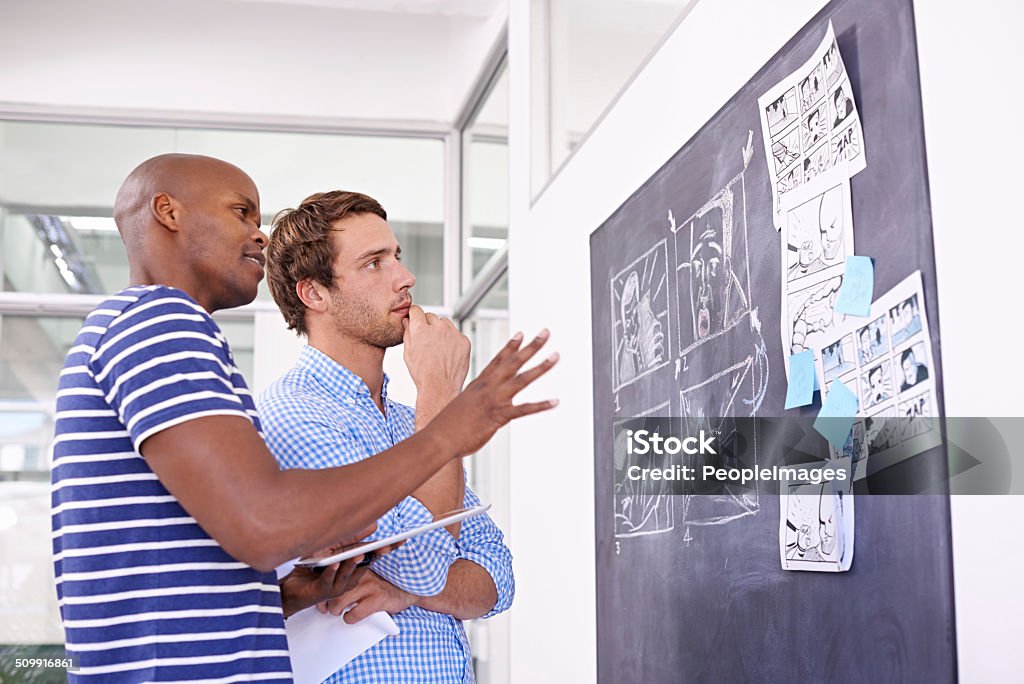 Getting his vision across Shot of two designers working at a chalkboardhttp://195.154.178.81/DATA/shoots/ic_783904.jpg Adult Stock Photo