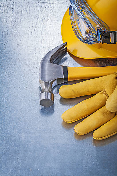 istock Protective eyewear building helmet safety gloves claw hammer con 509916874