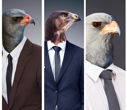 Conceptual image of animal heads on business people