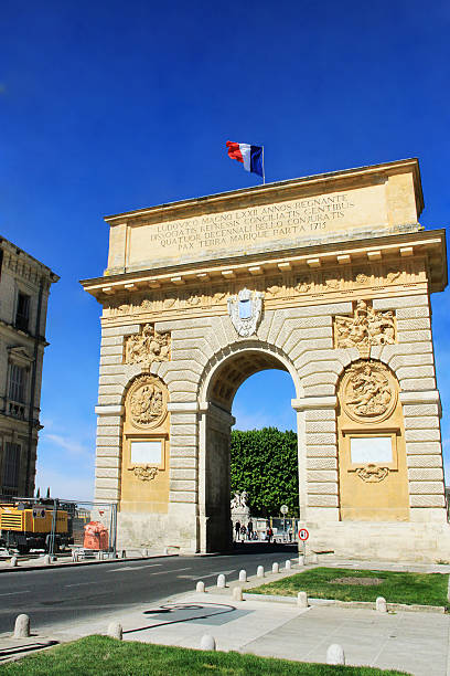 Triumphal Arch of Montpellier Montpellier, France - May 27, 2014: Triumphal Arch of Montpellier, southern French city, capital of the Languedoc-Roussillon region on sunny day. nostradamus stock pictures, royalty-free photos & images