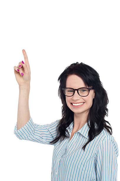 istock Charming pretty woman pointing upwards 509918381
