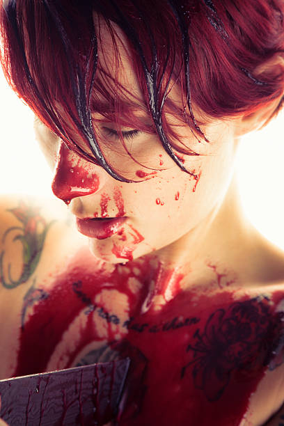 istock Redhead With A Knife In Her Chest 509918543