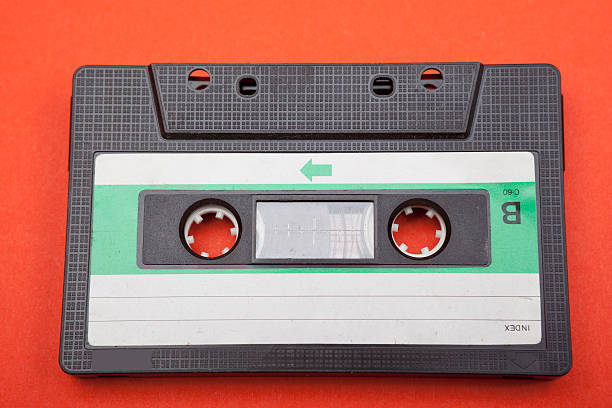 Old fashioned Compact Audio Tape Cassette on red background