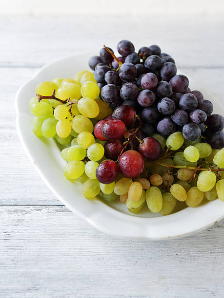 istock grapes on vintage plate 509919182