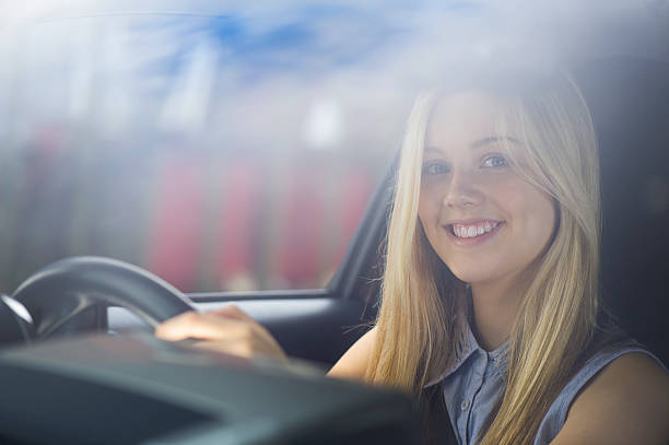 young woman driving her car