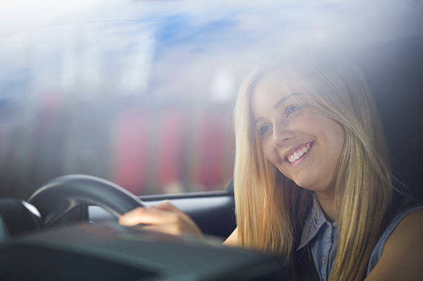 istock young woman driving her car 509921307