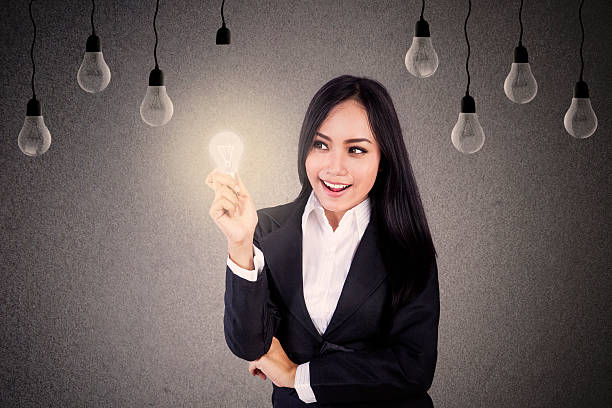 istock Businesswoman with light bulbs 509921425