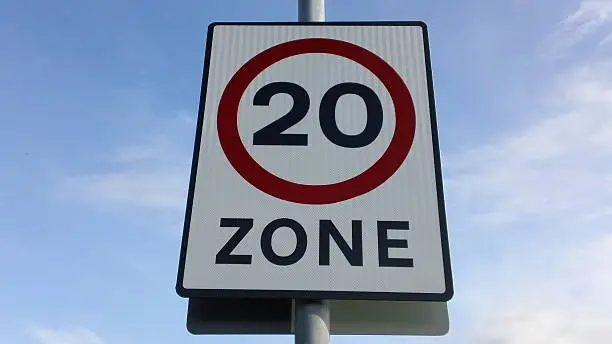 Ministry of Transport UK speed limit road sign indicating maximum speed of 20mph allowable.