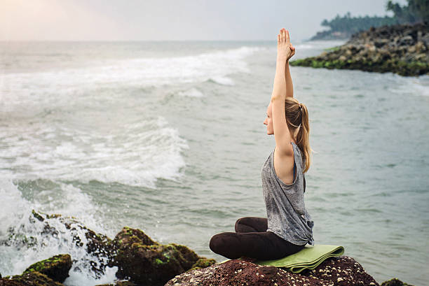 istock Meditation near the sea on sunset 509921924
