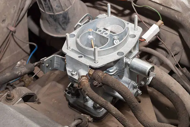 motor car compartment and a new carburetor