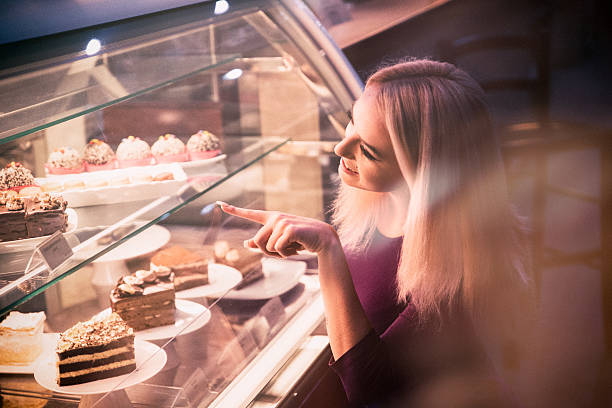 istock Young woman choosing a pastry in a bakery 509923754