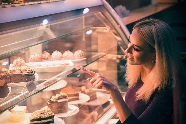 istock Young woman choosing a pastry in a bakery 509924472
