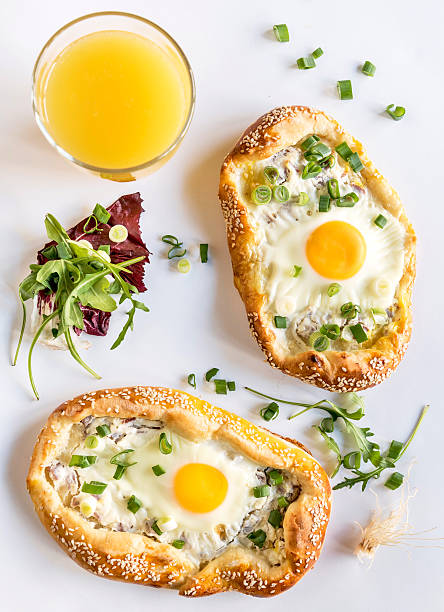 istock Mini pizza and orange juice 509925442