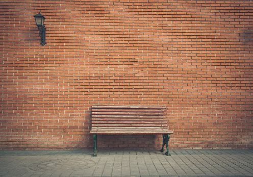 Empty public bench on a sunny day.