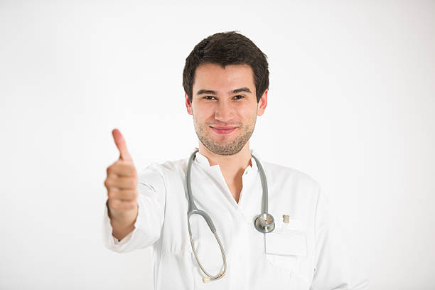 istock young doctor holds thumb up 509925950