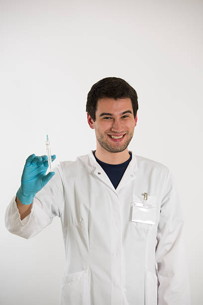 istock young doctor with syringe 509926318