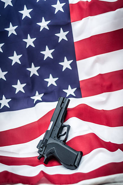 istock Gun on USA flag 509927494