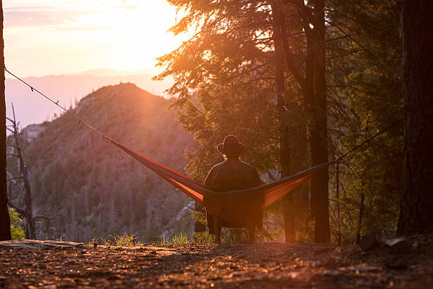 istock Man in hammock sunset or sunrise 509928420