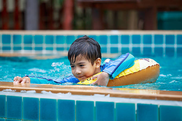 istock Asian boy in the pool 509928884