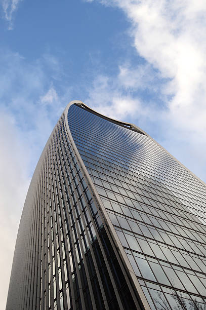 istock Skyscraper skyline view of a building with clouds in sky 509928922