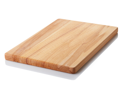 Brown wooden cutting board isolated on white background. Clipping path