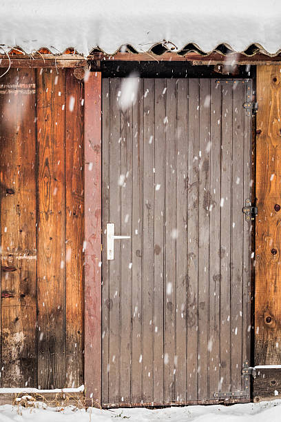 istock Wooden door under heavy snow 509932520