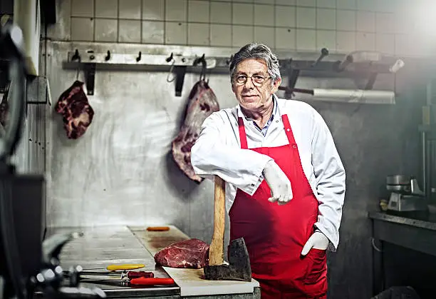 Portrait of a Butcher Standing in a Butcher's Shop