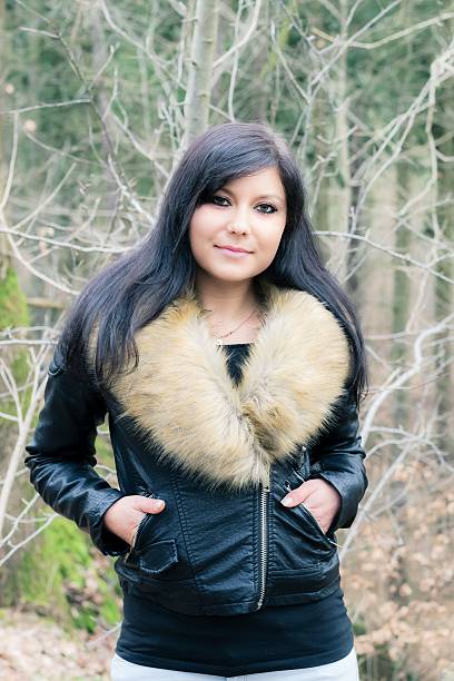 istock young woman with fur jacket II 509935390