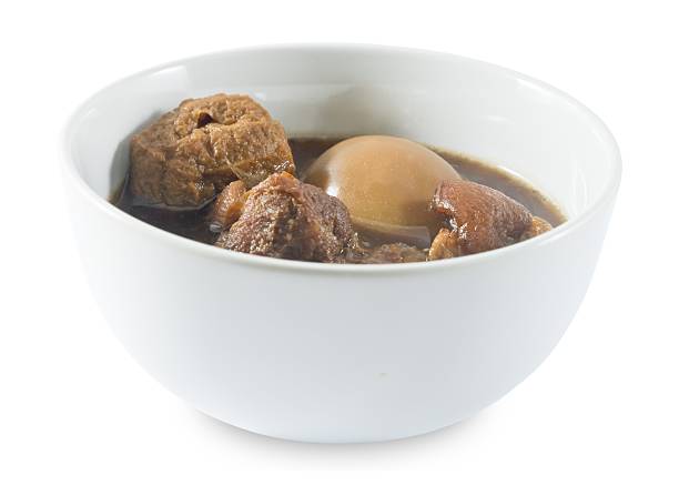 istock Five Spice Stew with Egg and Pork on White Background 509935616