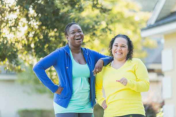istock Multi-racial women laughing together outdoors 509936122