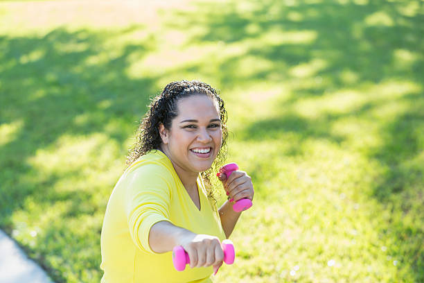 istock Hispanic woman doing aerobic exercises with dumbbells 509936180