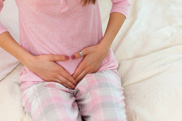 istock Woman with a stomach ache 509936258