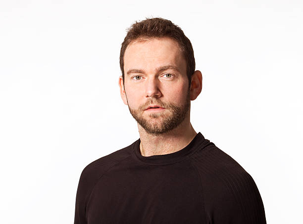istock Handsome young man portrait in black. 509936786